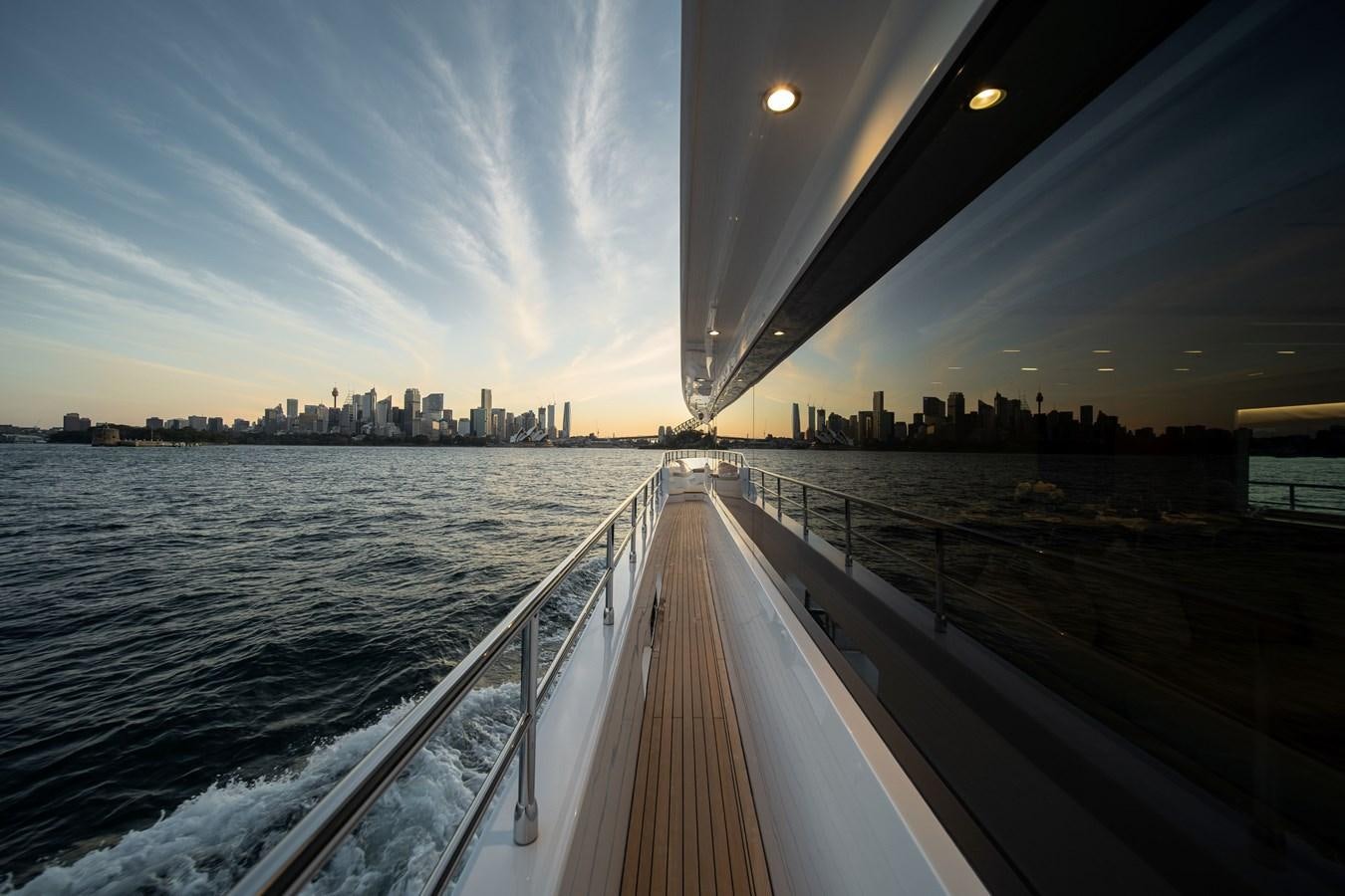 a view of a city from a boat aboard #5 NOMAD 101 Yacht for Sale