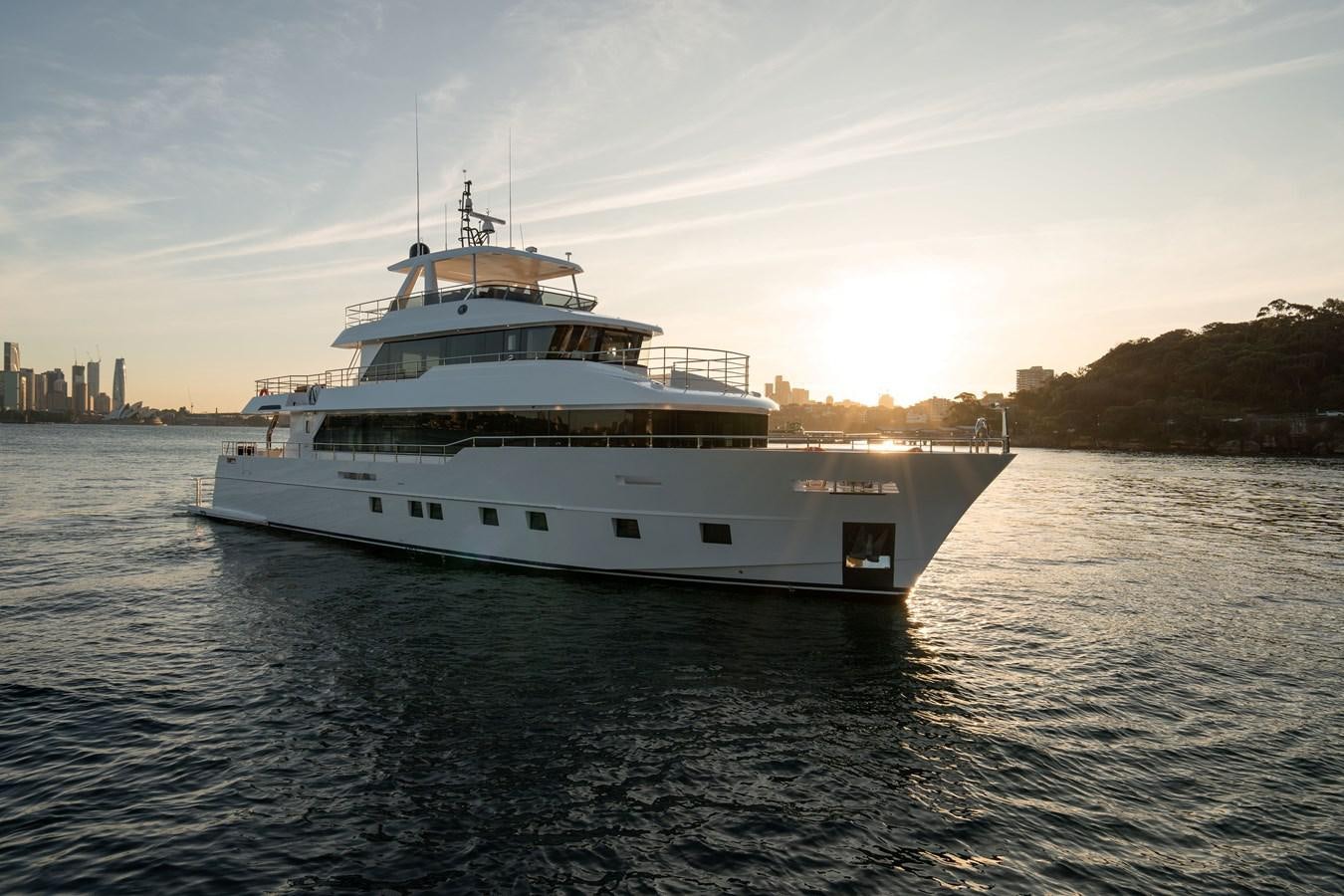a large white boat on the water aboard #5 NOMAD 101 Yacht for Sale