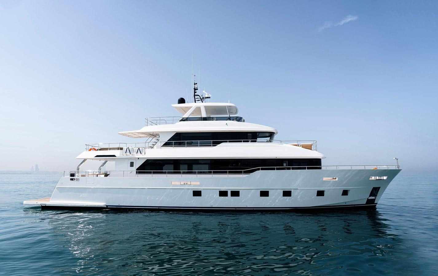 a white yacht in the water aboard #5 NOMAD 101 Yacht for Sale