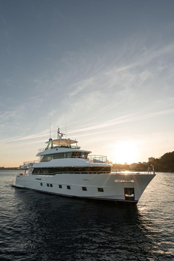a large white boat on the water aboard #5 NOMAD 101 Yacht for Sale