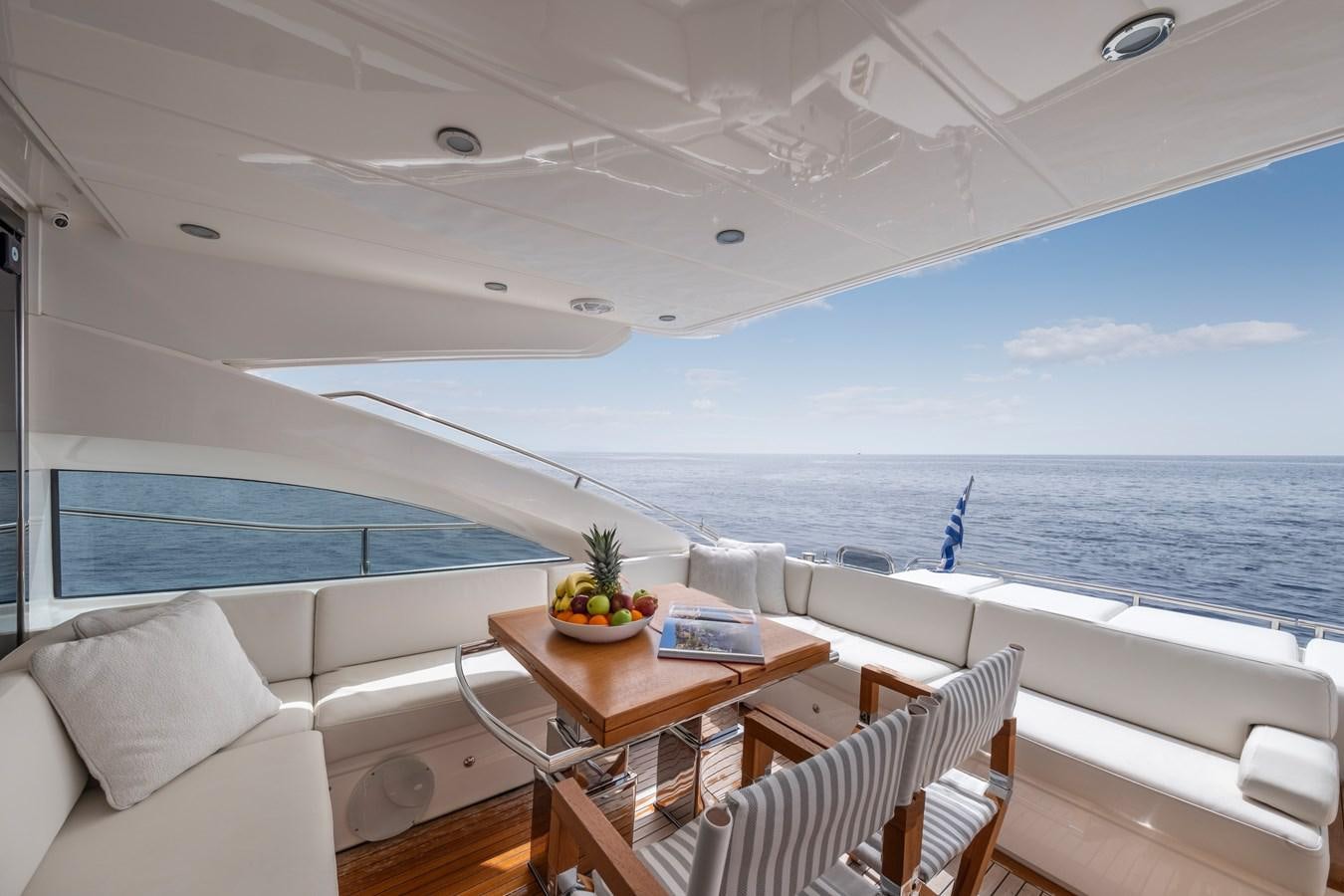 a boat with a table and chairs aboard WANDERER Yacht for Sale