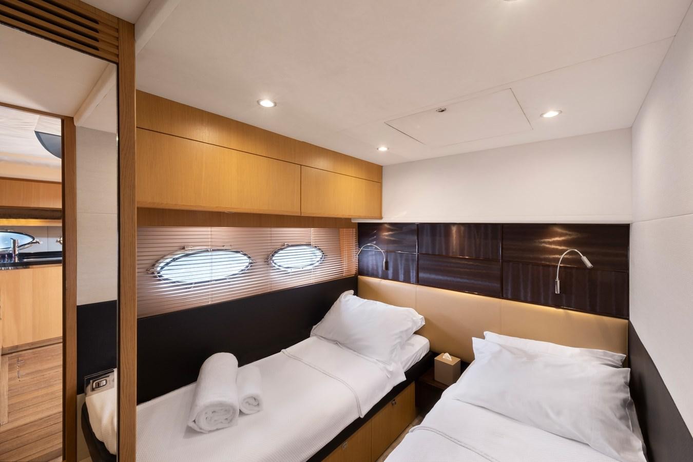 a room with a bed and a mirror aboard WANDERER Yacht for Sale