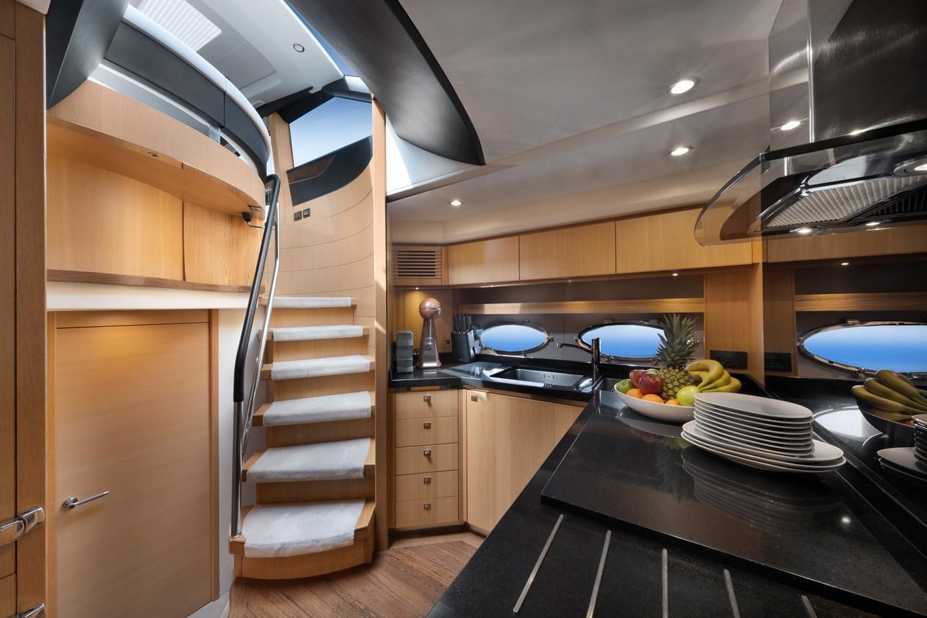 a kitchen with a large metal ladder aboard WANDERER Yacht for Sale