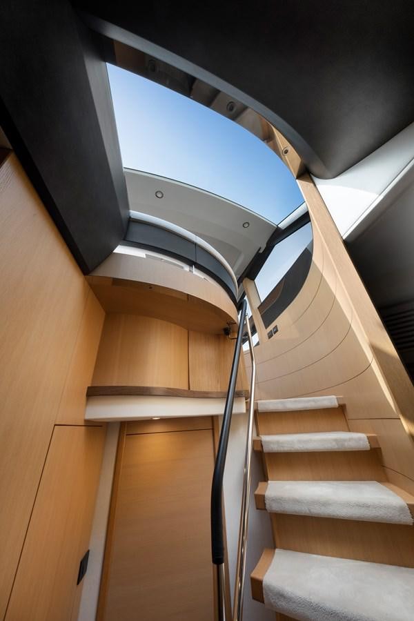 a staircase with a metal railing aboard WANDERER Yacht for Sale