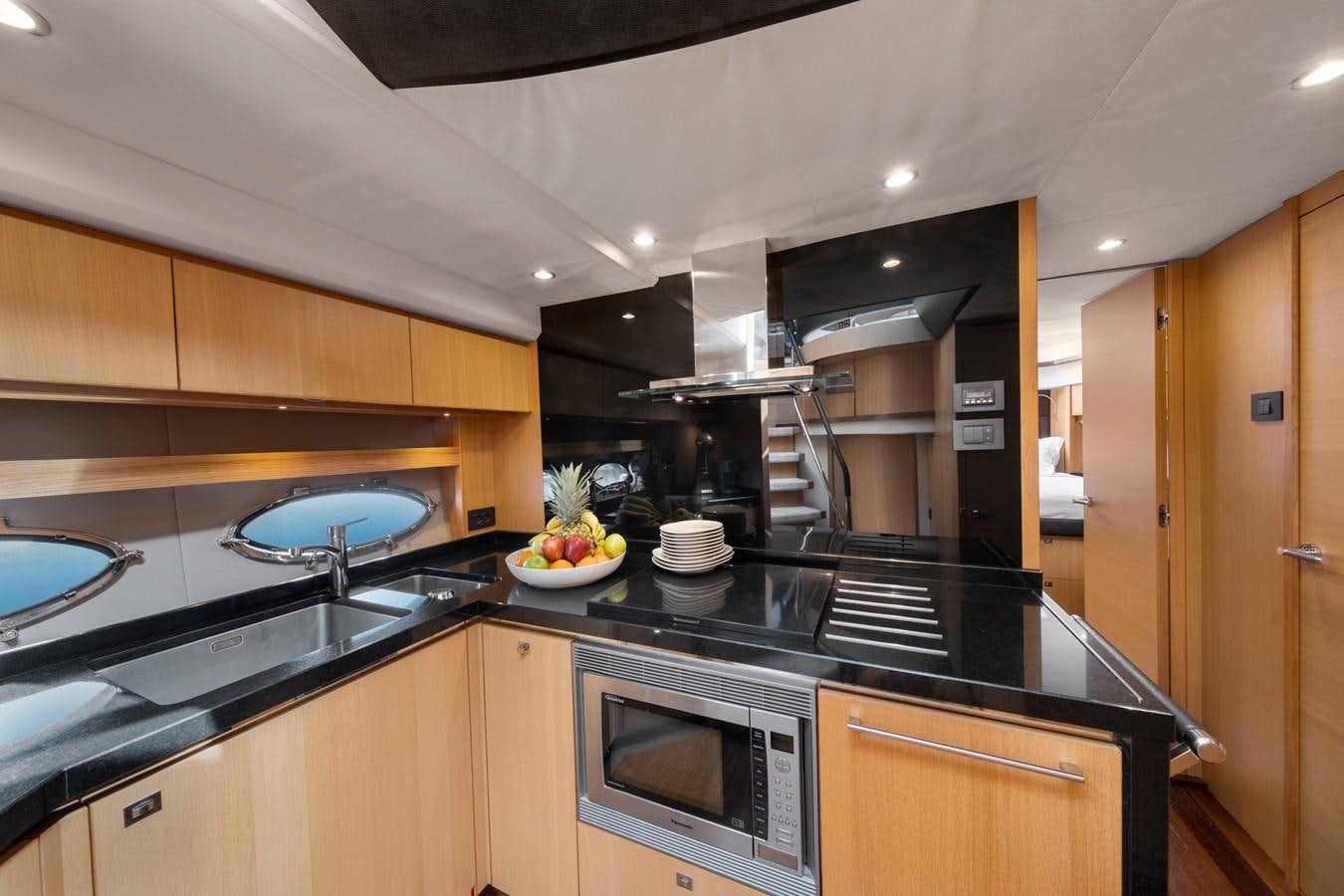 a kitchen with a large oven and a large umbrella aboard WANDERER Yacht for Sale
