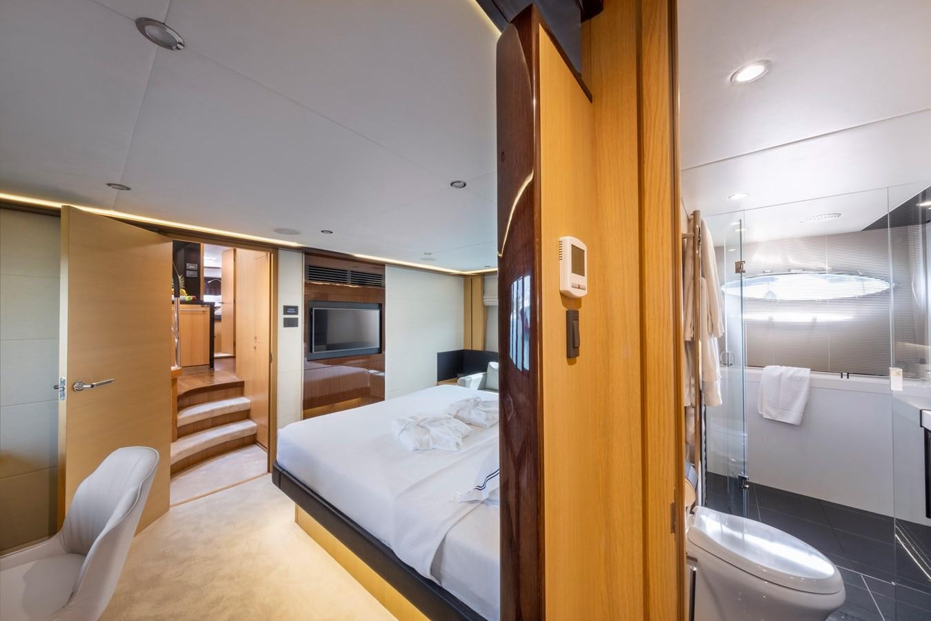a bathroom with a bed and a hallway aboard WANDERER Yacht for Sale