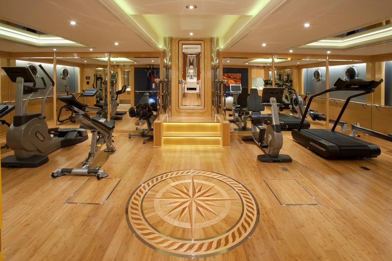 a gym with exercise equipment aboard ATTESSA IV Yacht for Sale