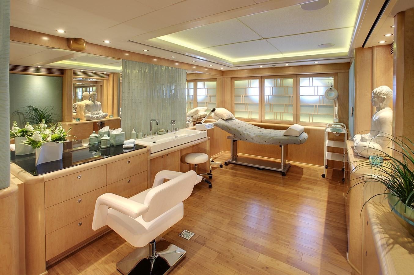 a room with a bed and a bench aboard ATTESSA IV Yacht for Sale