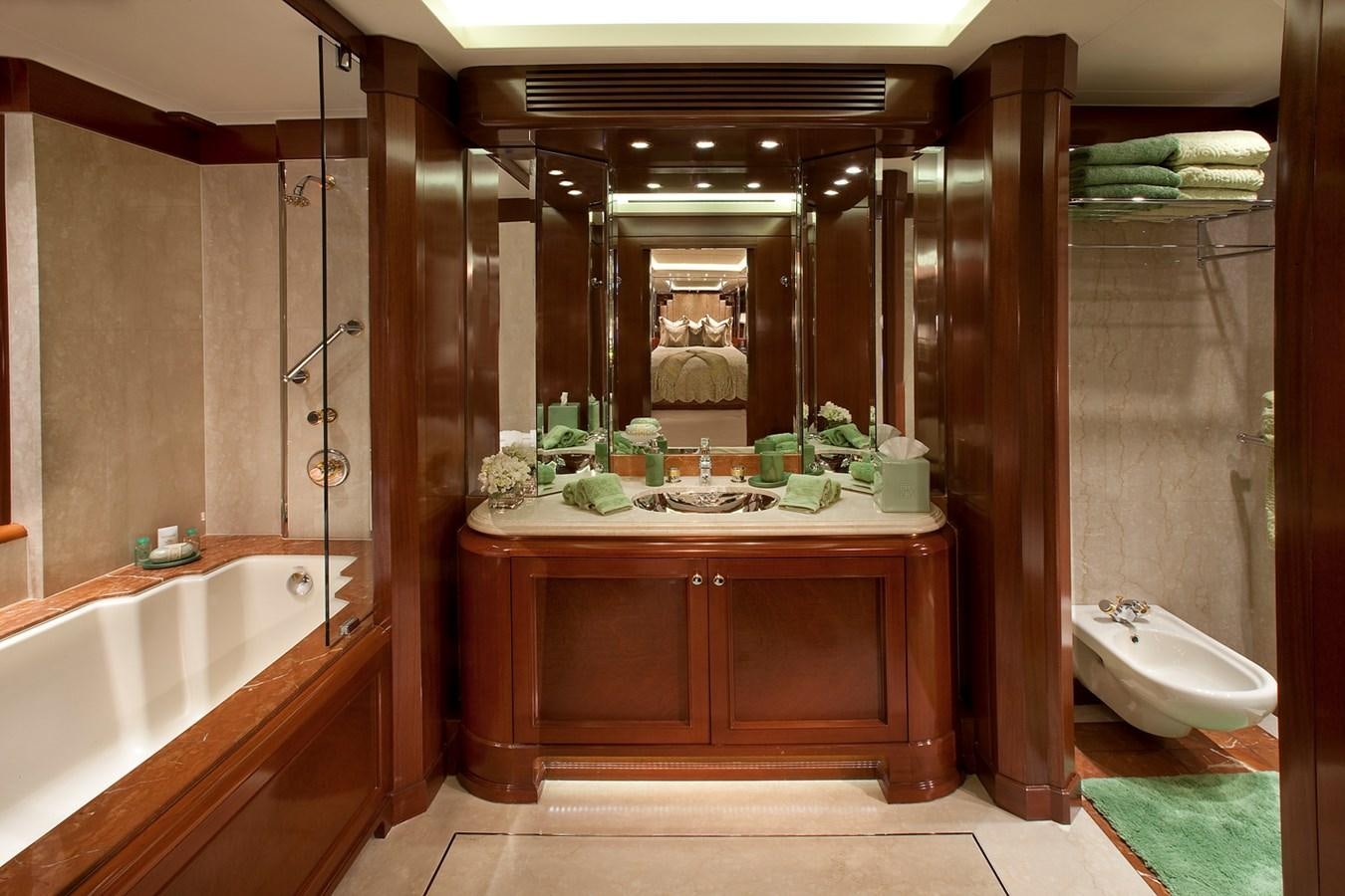a bathroom with a tub sink and a toilet aboard ATTESSA IV Yacht for Sale
