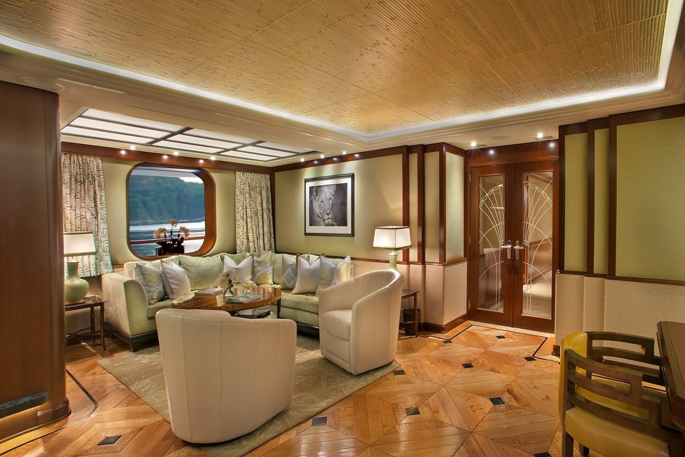 a living room with a large mirror aboard ATTESSA IV Yacht for Sale