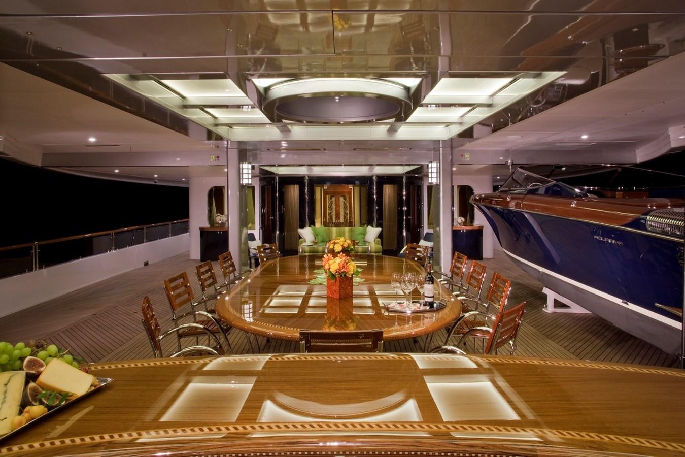 a large room with tables and chairs aboard ATTESSA IV Yacht for Sale
