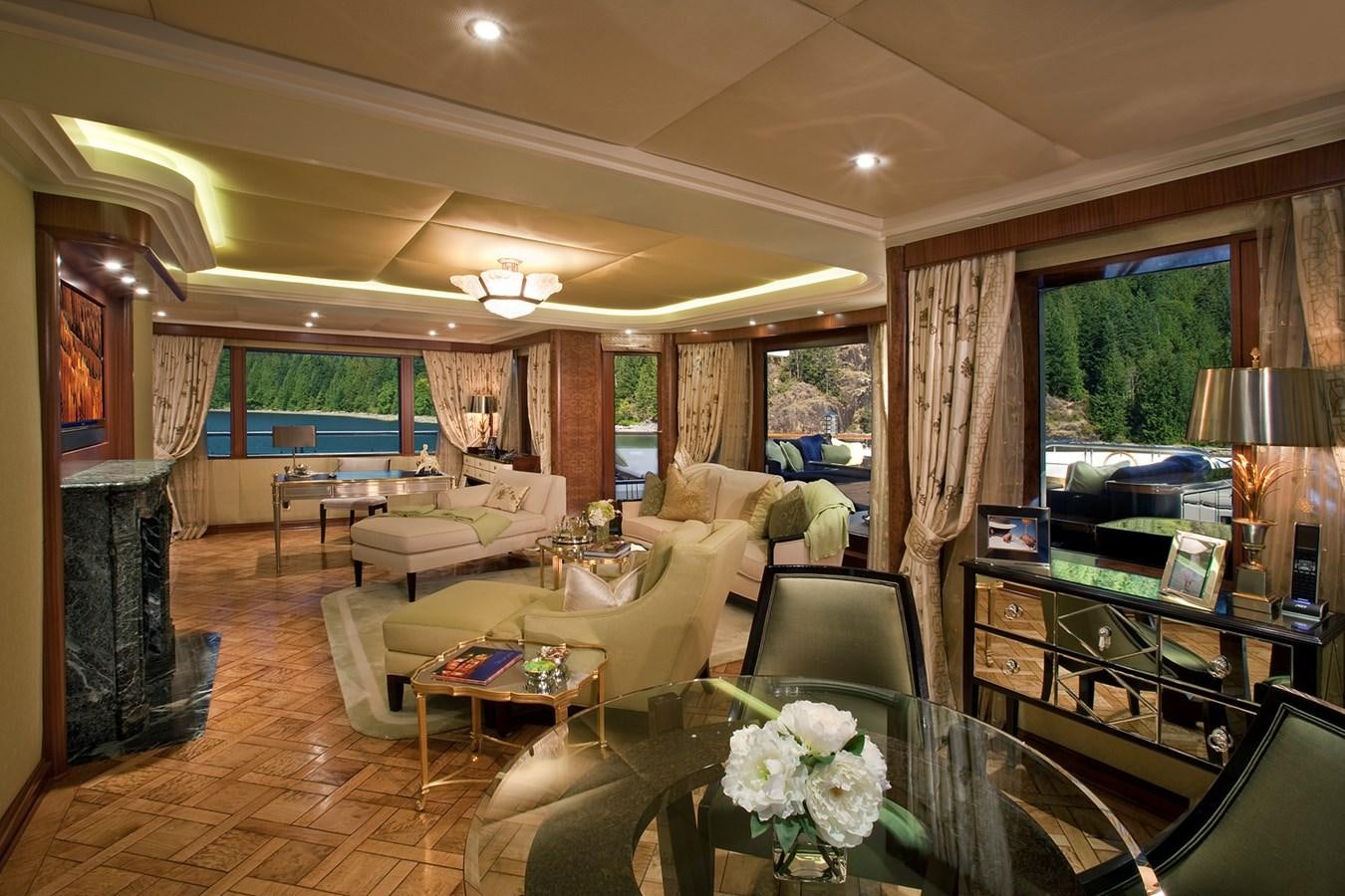 a living room with a fireplace aboard ATTESSA IV Yacht for Sale