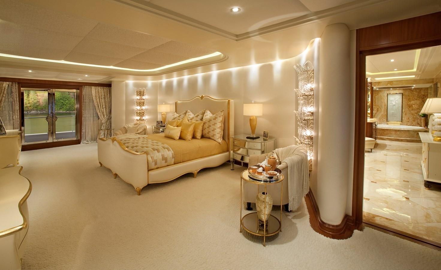 a large living room with a large mirror aboard ATTESSA IV Yacht for Sale