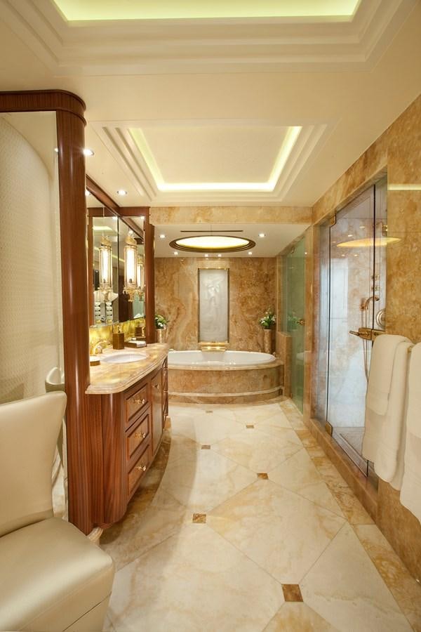a bathroom with a tub sink and a mirror aboard ATTESSA IV Yacht for Sale