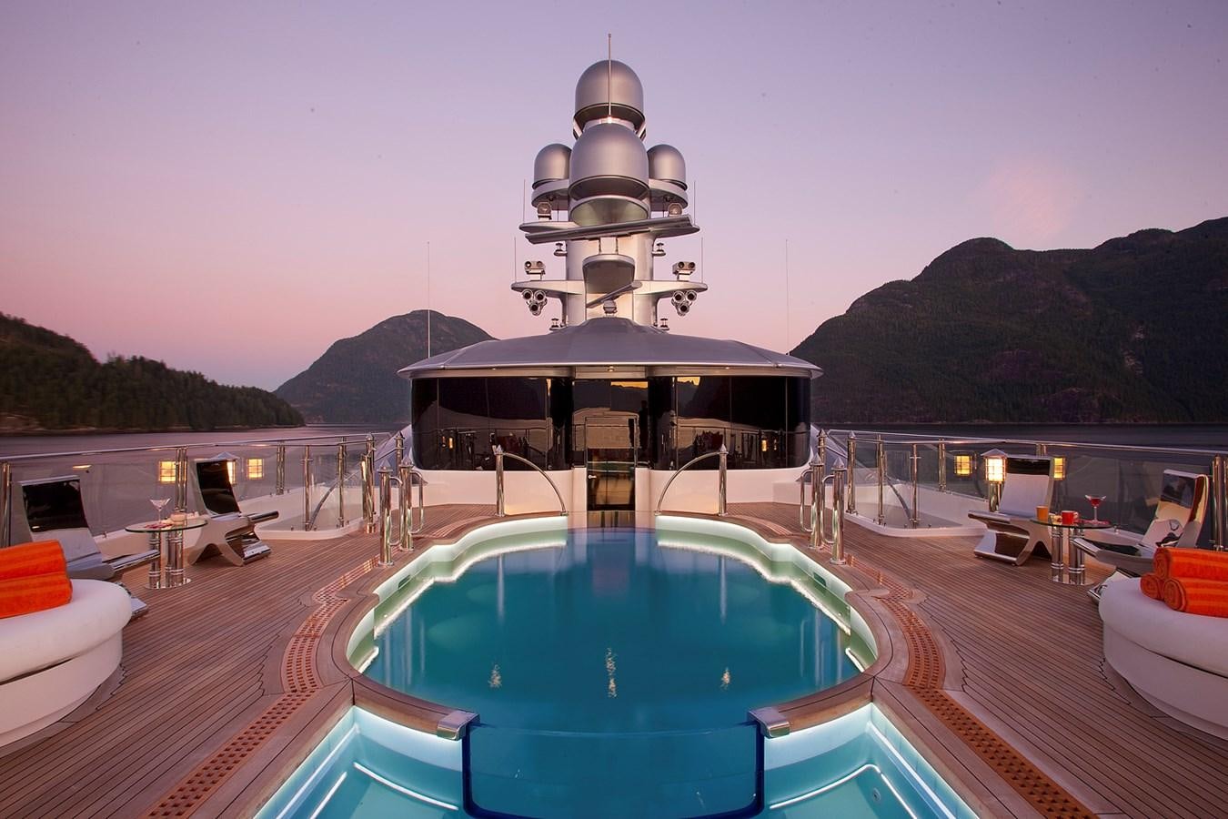 a pool next to a building aboard ATTESSA IV Yacht for Sale