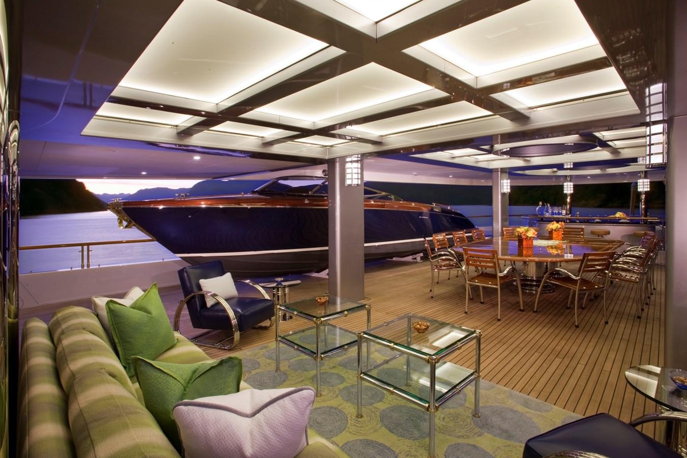a room with a table and chairs aboard ATTESSA IV Yacht for Sale