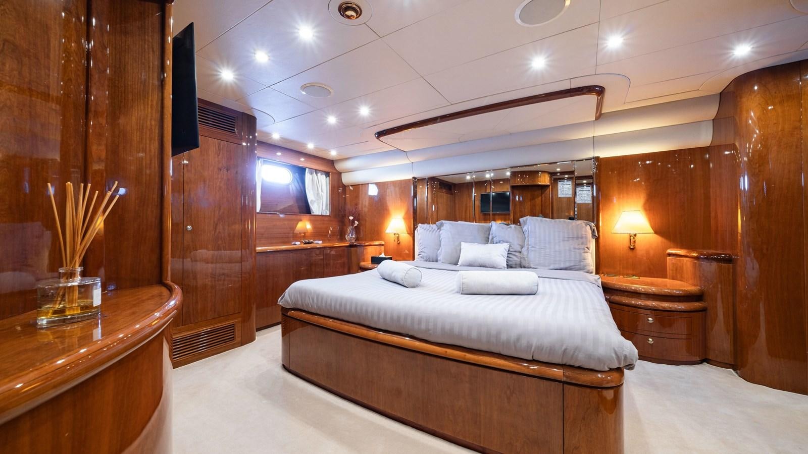 a room with a bed and a desk aboard BEIJA FLORE Yacht for Sale