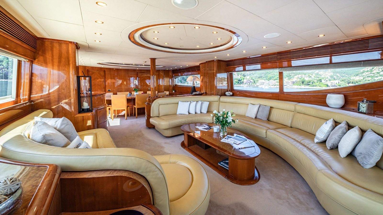 a living room with a couch and a coffee table aboard BEIJA FLORE Yacht for Sale