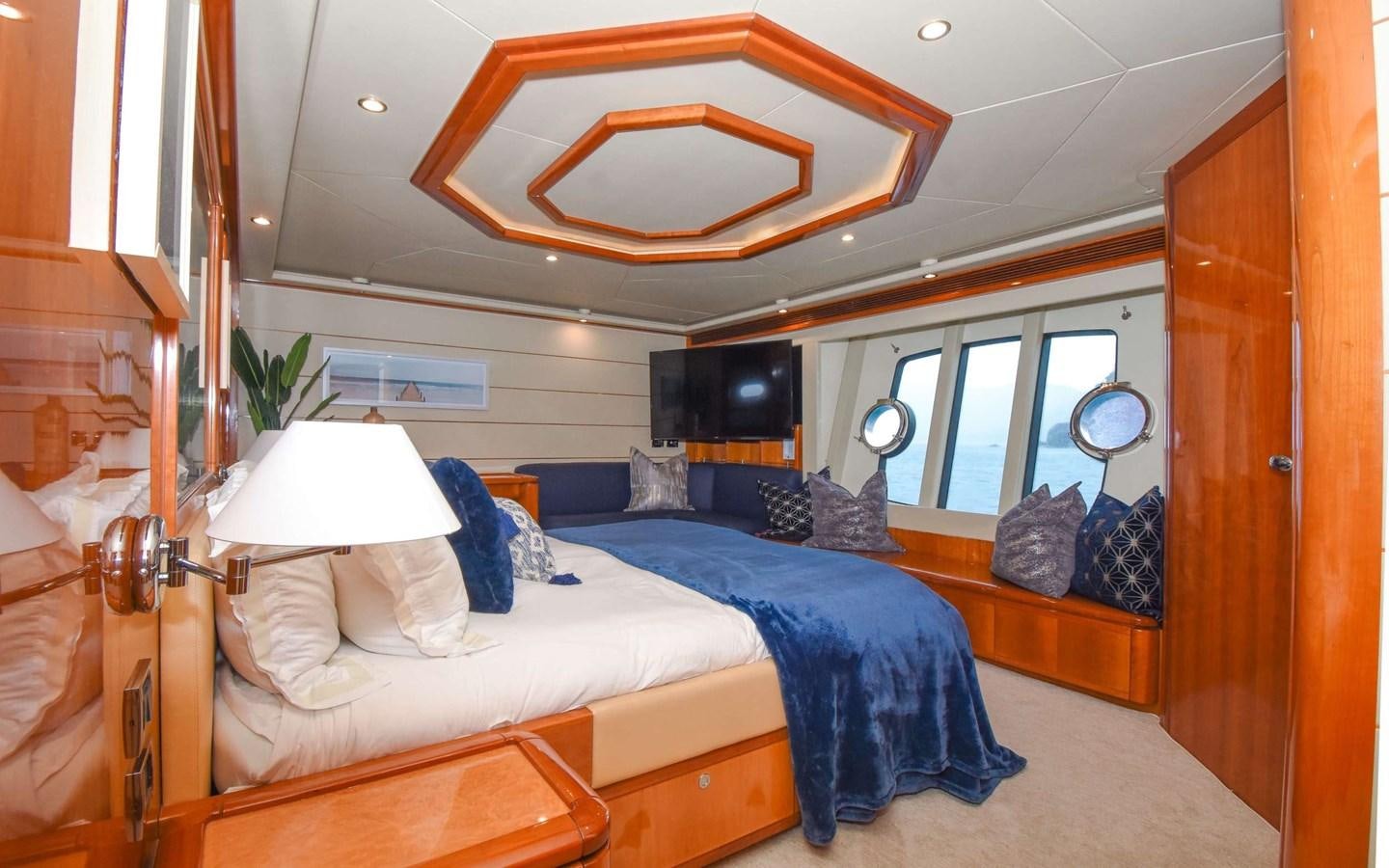 a bedroom with a bed and a mirror aboard FER88117B606 Yacht for Sale