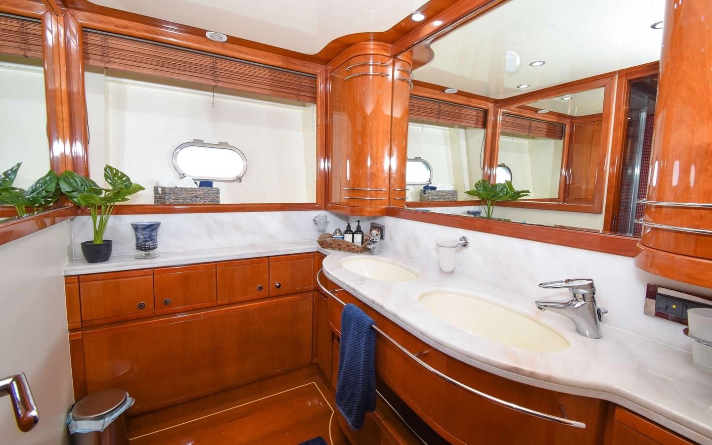 a bathroom with a large mirror aboard FER88117B606 Yacht for Sale