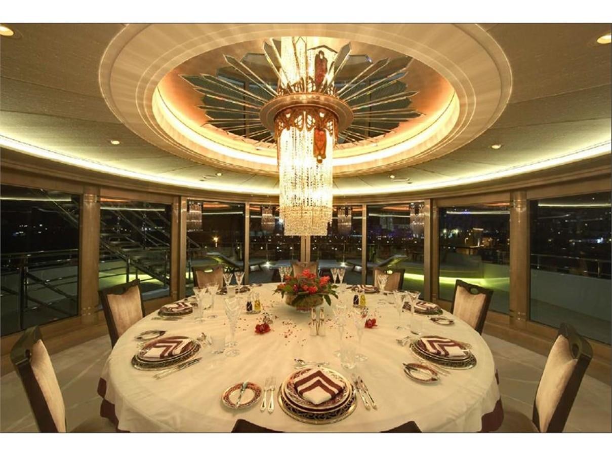 a large dining room with a chandelier aboard AMARYLLIS Yacht for Sale