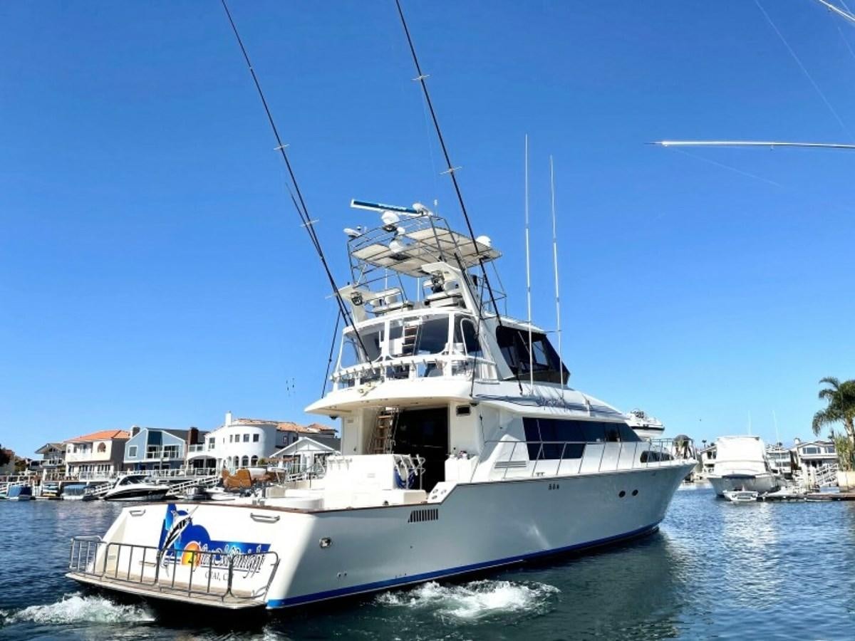 a large white boat in the water aboard AFTER MIDNIGHT Yacht for Sale