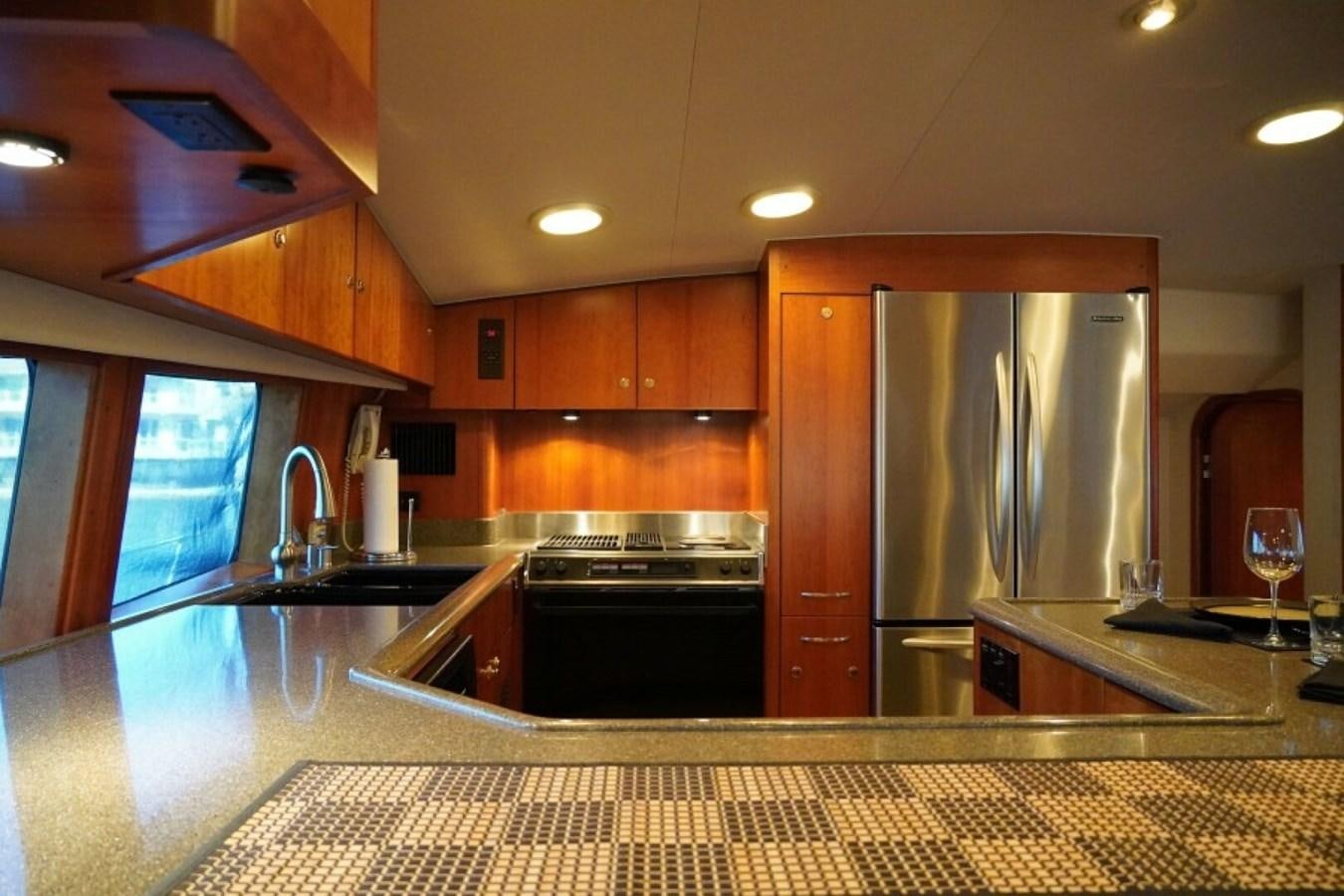 a kitchen with stainless steel appliances aboard AFTER MIDNIGHT Yacht for Sale