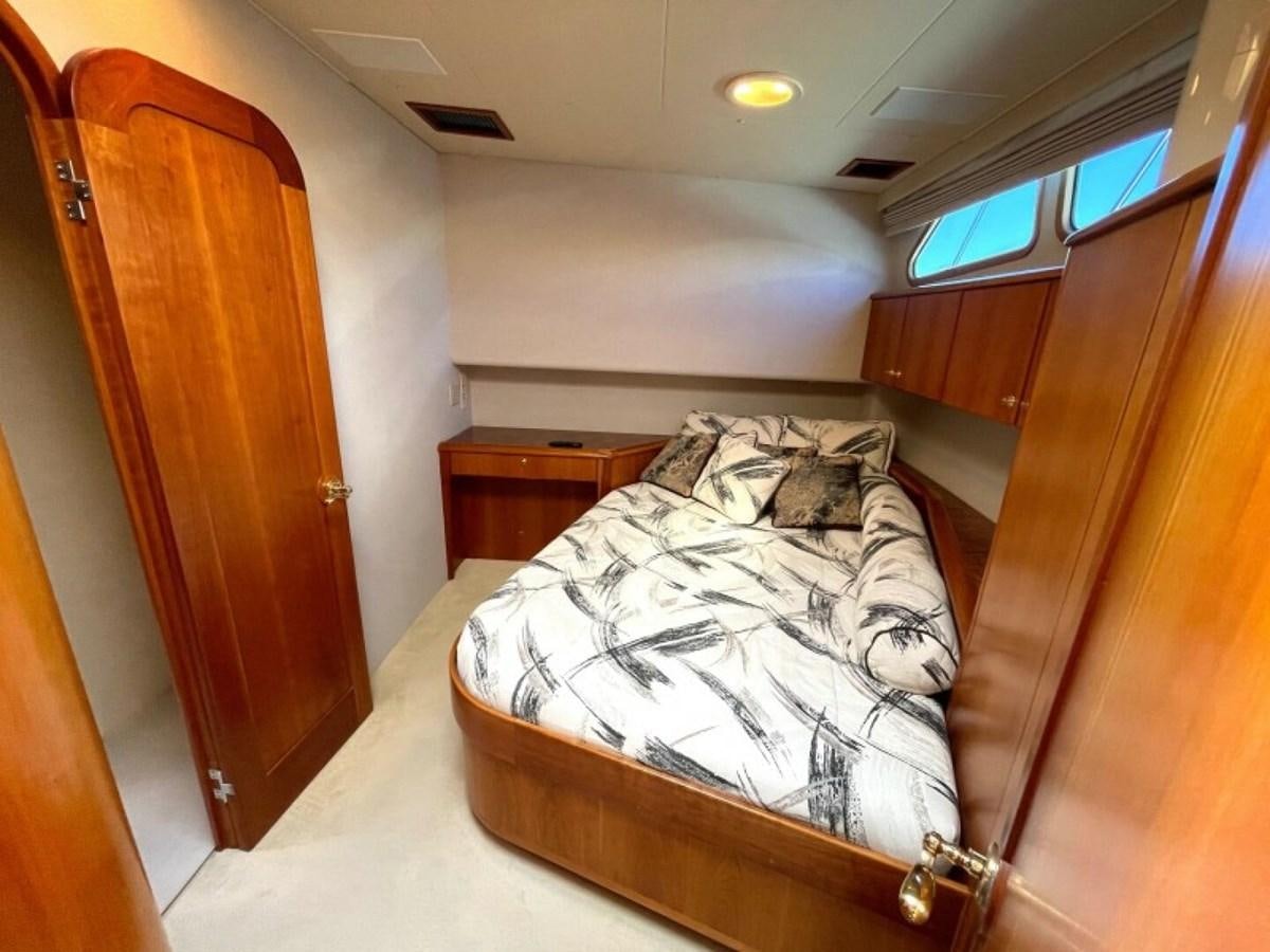 a bed in a room aboard AFTER MIDNIGHT Yacht for Sale