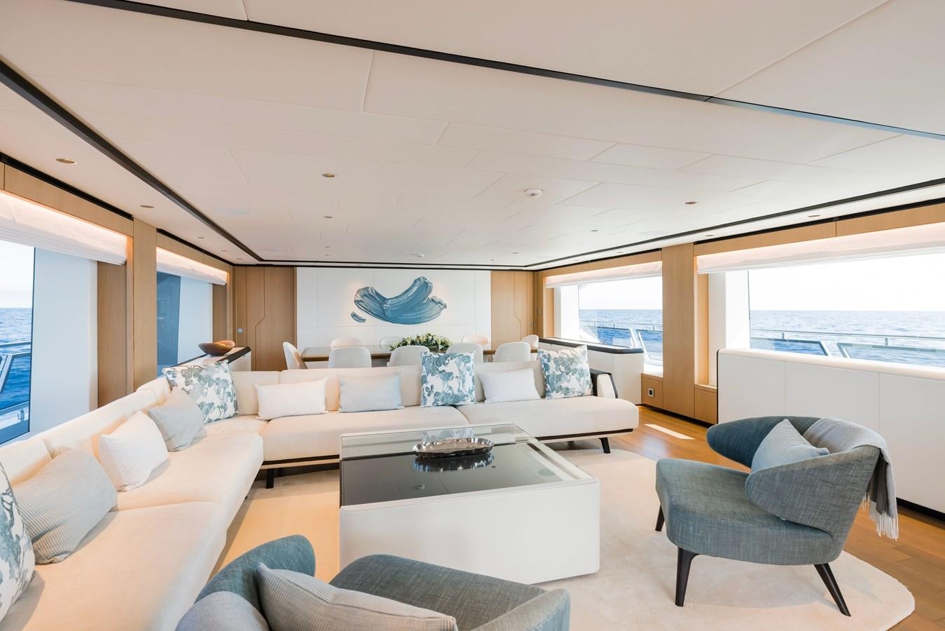 a living room with a couch and a table aboard MAJESTY 111 Yacht for Sale