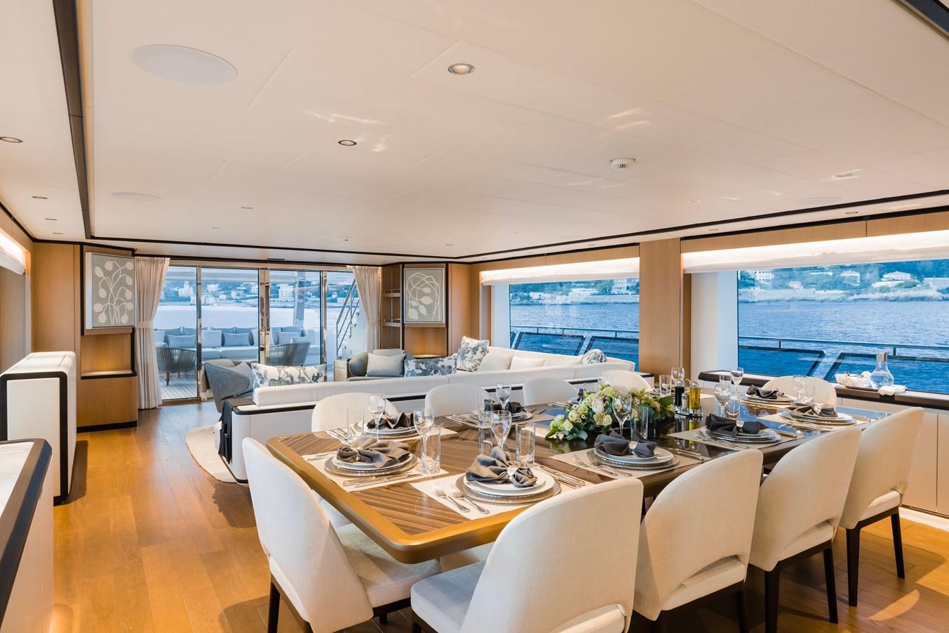 a large dining room with a large window aboard MAJESTY 111 Yacht for Sale
