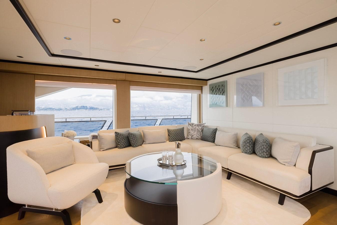 a living room with a couch and a table aboard MAJESTY 111 Yacht for Sale