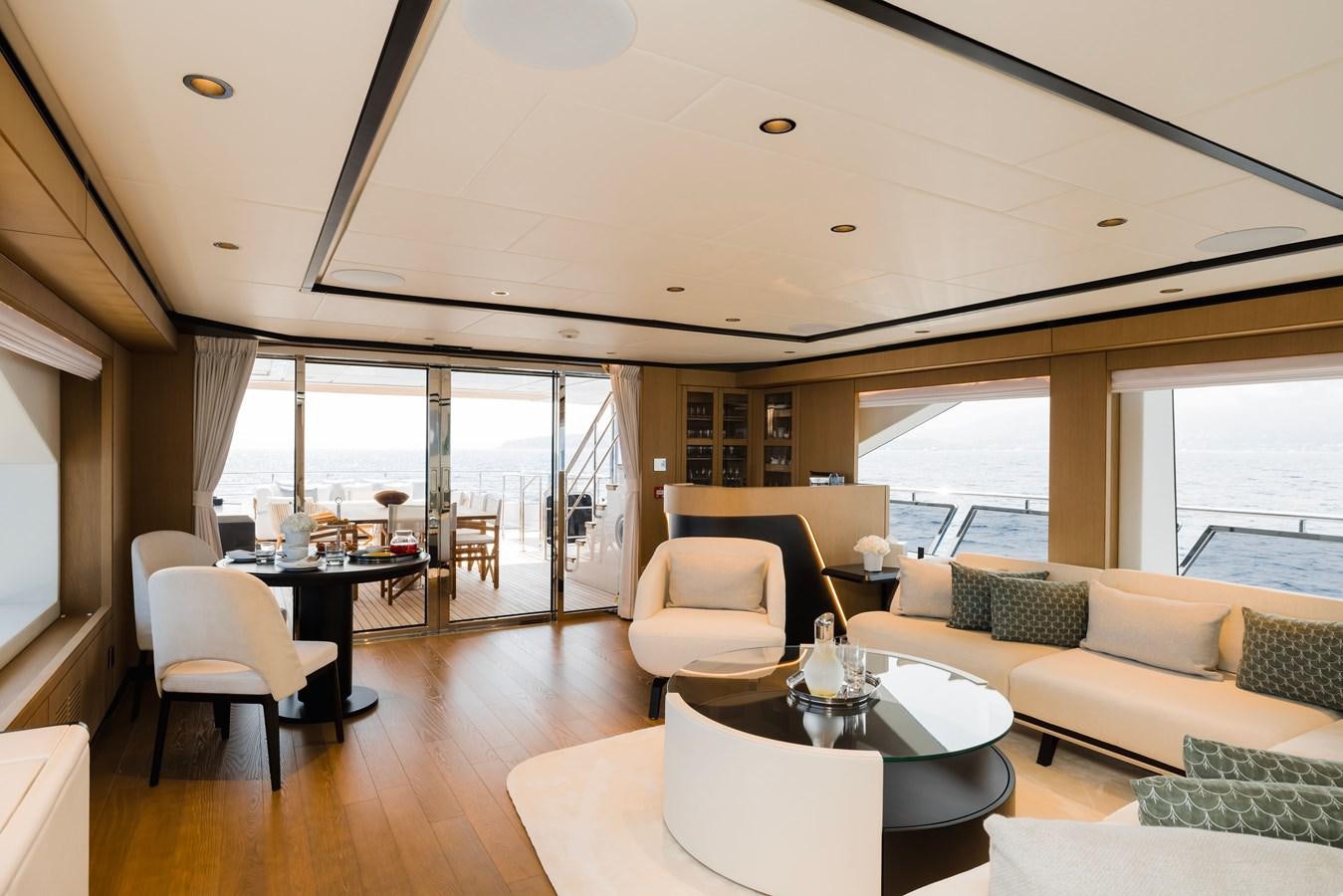 a living room with a large window aboard MAJESTY 111 Yacht for Sale