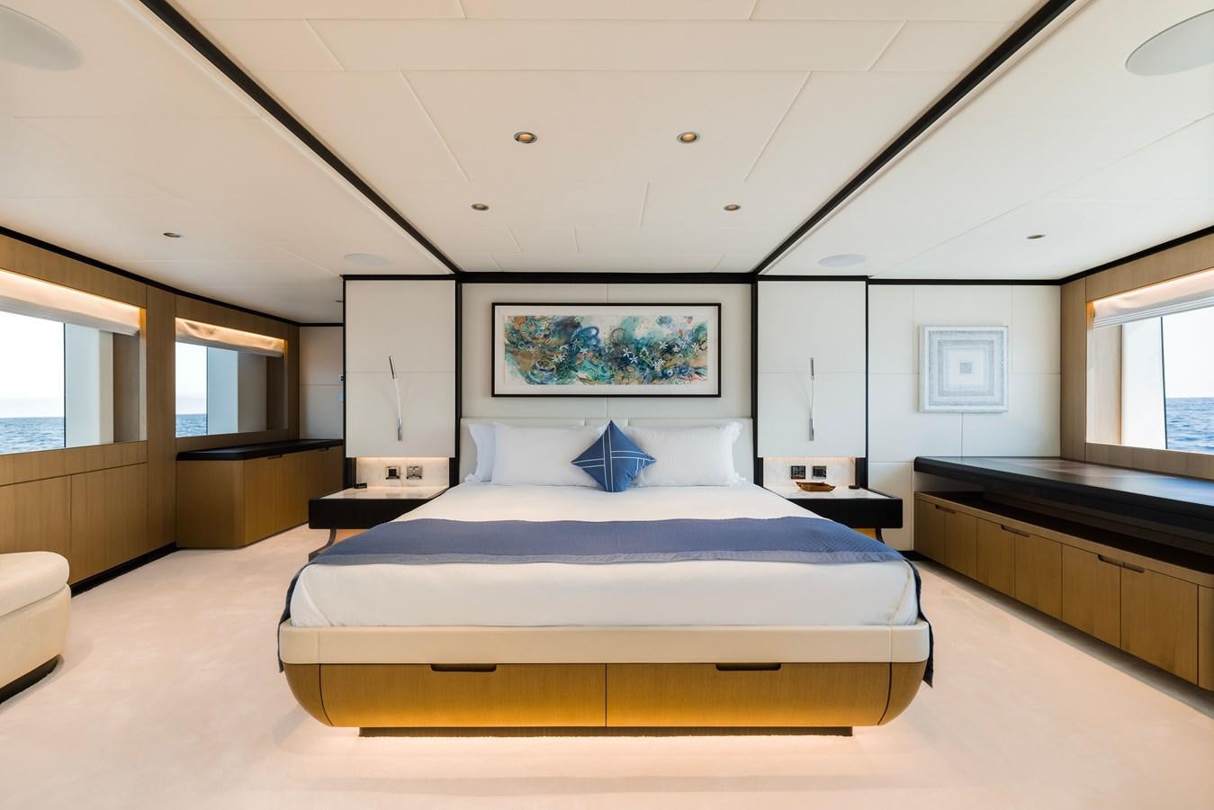 a large bed in a room aboard MAJESTY 111 Yacht for Sale