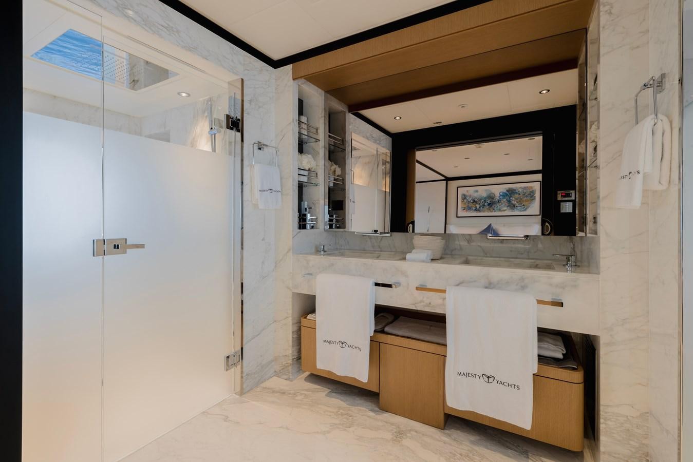a room with white cabinets aboard MAJESTY 111 Yacht for Sale