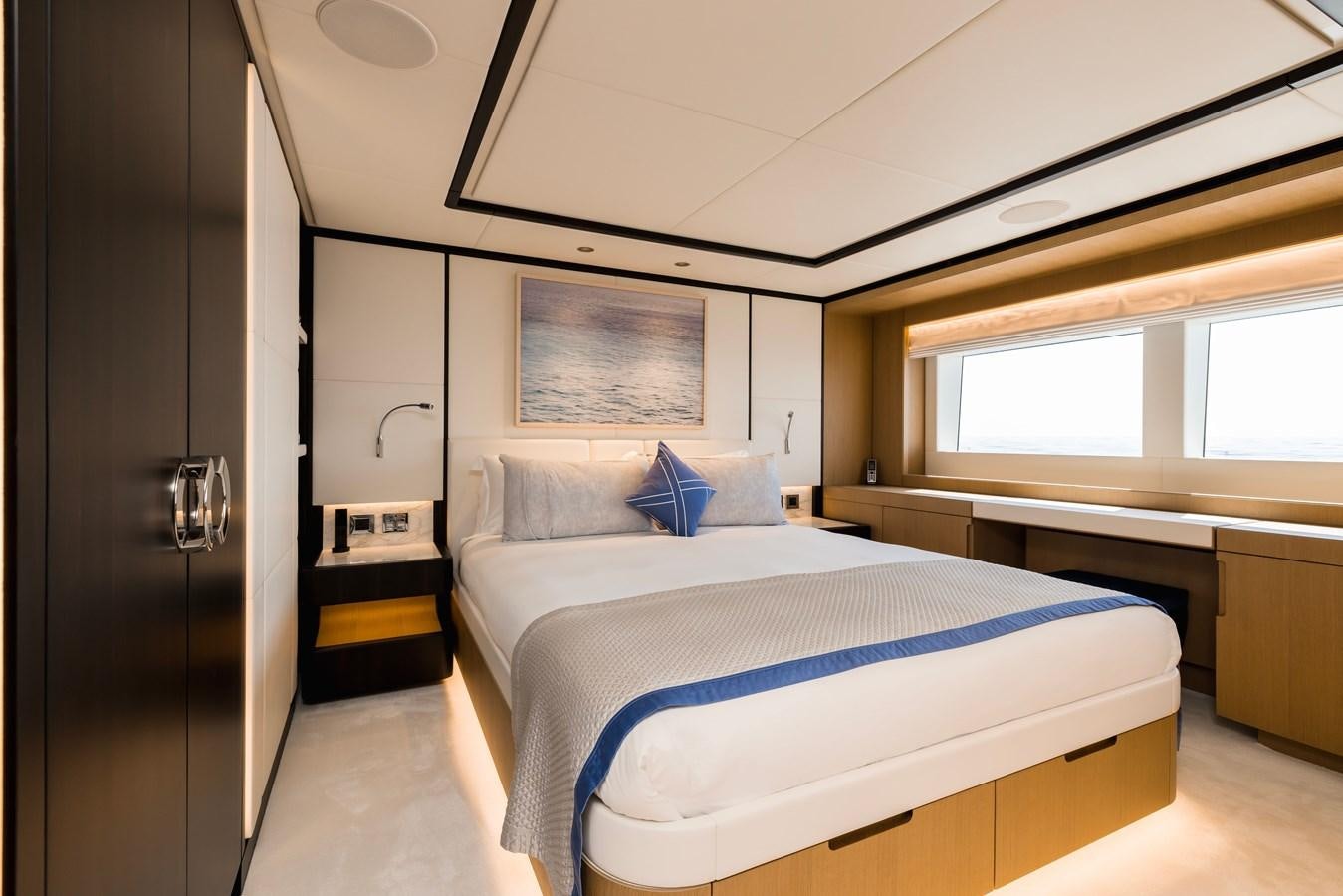 a room with a couple of beds aboard MAJESTY 111 Yacht for Sale