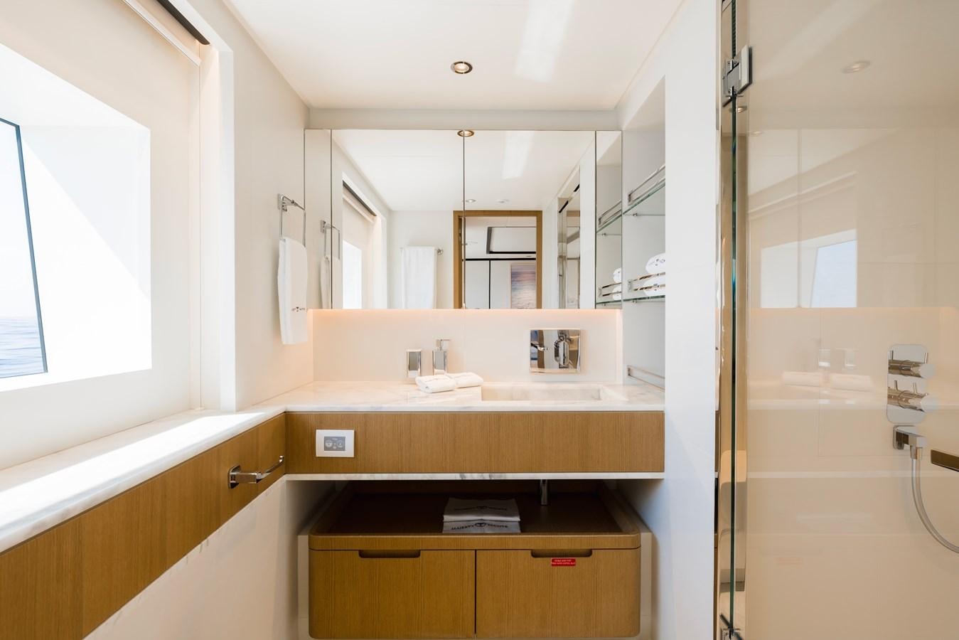 a bathroom with a shower unit and sink aboard MAJESTY 111 Yacht for Sale