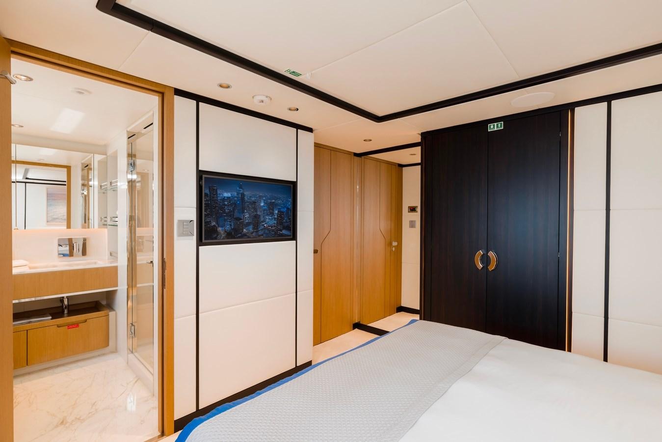 a room with a large blue screen aboard MAJESTY 111 Yacht for Sale