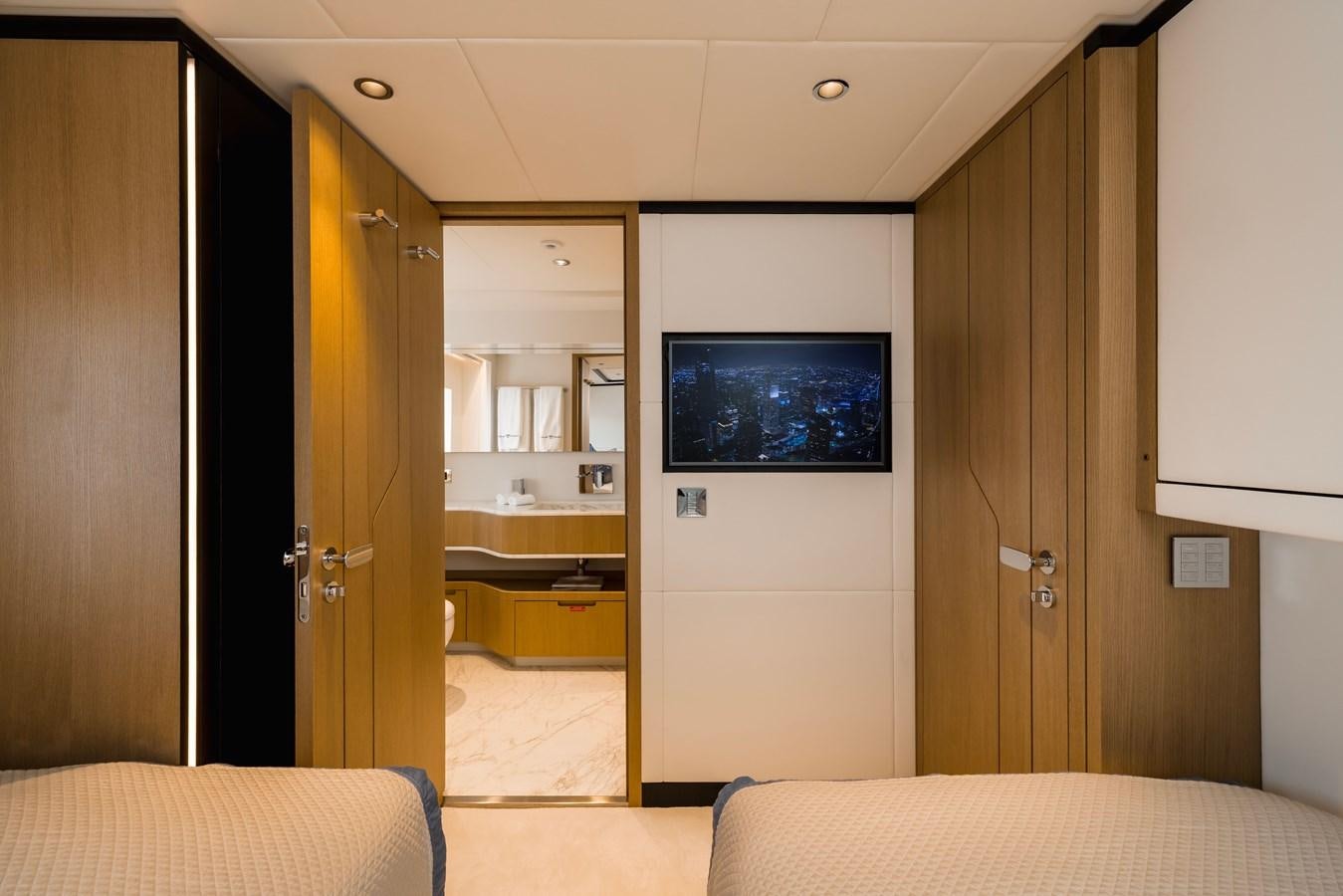 a hotel room with a tv aboard MAJESTY 111 Yacht for Sale