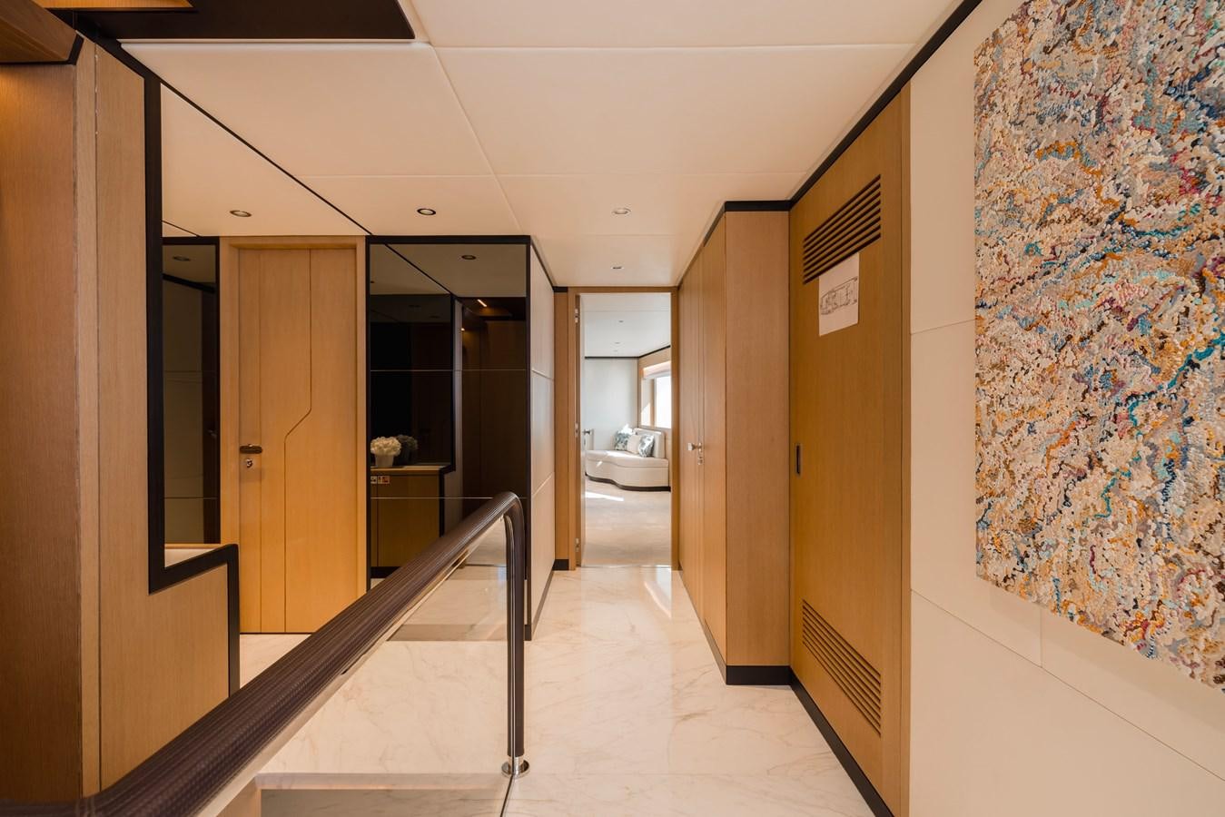 a hallway with doors aboard MAJESTY 111 Yacht for Sale