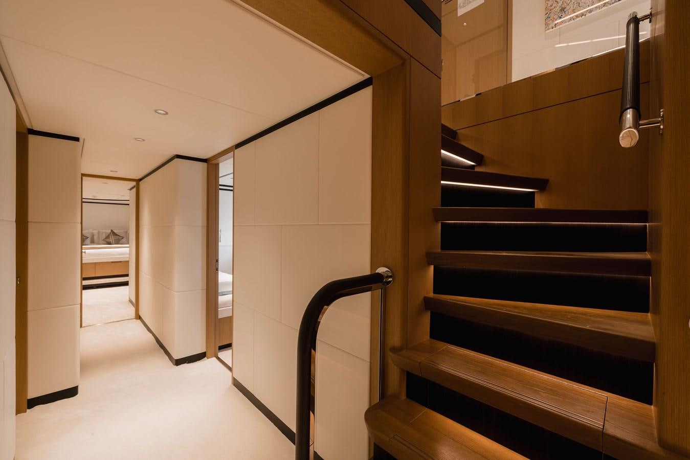 a hallway with a set of stairs aboard MAJESTY 111 Yacht for Sale
