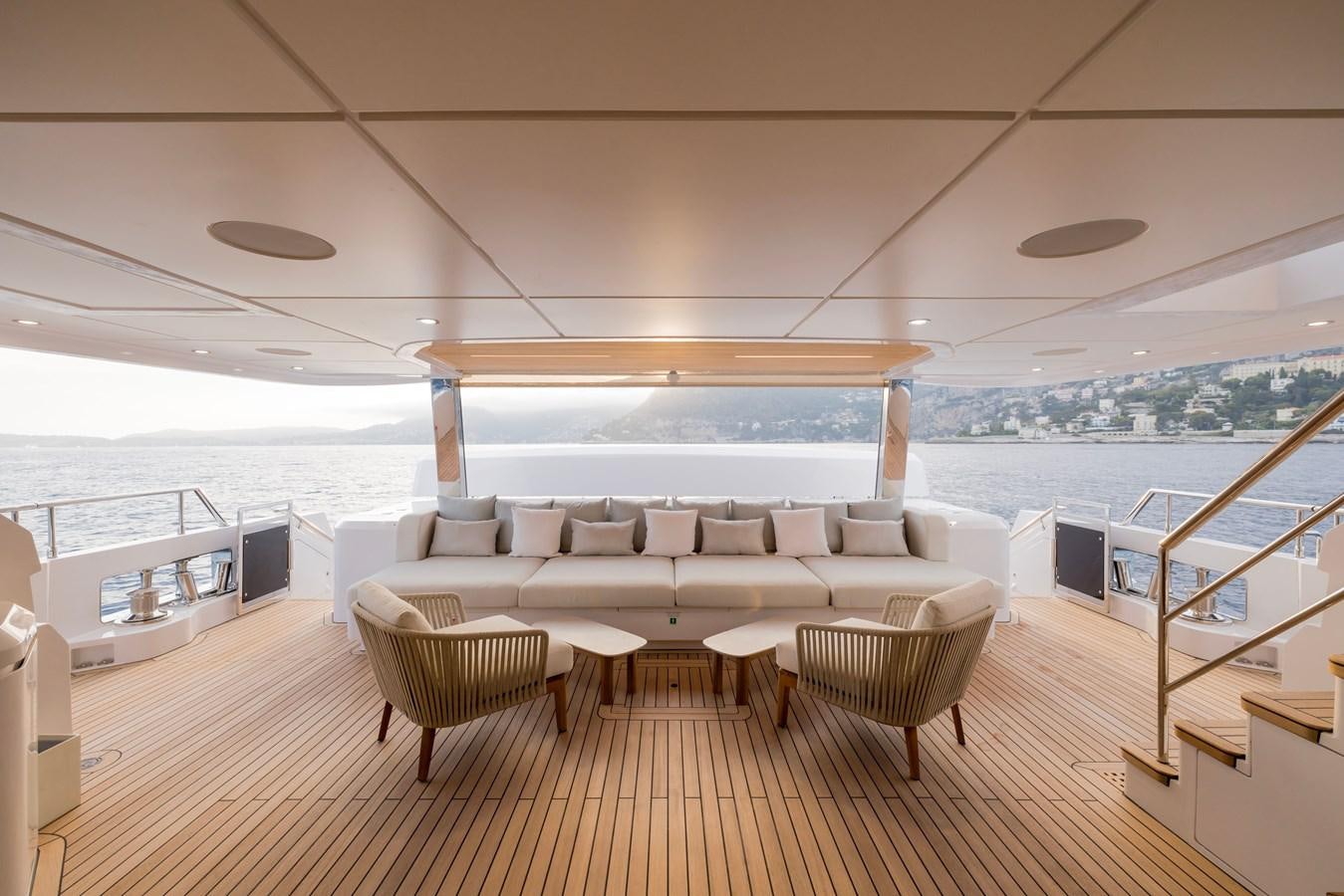 a large living room with a large balcony overlooking the water aboard MAJESTY 111 Yacht for Sale