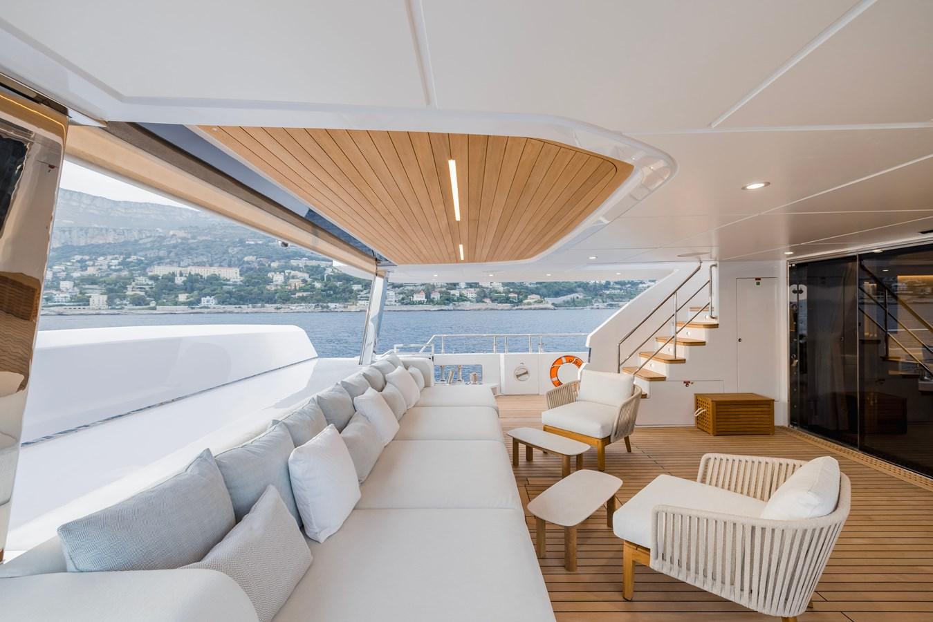 a large living room with a large balcony aboard MAJESTY 111 Yacht for Sale