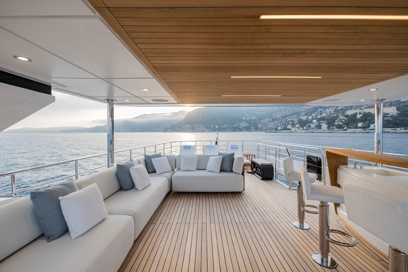 a large living room with a large balcony aboard MAJESTY 111 Yacht for Sale