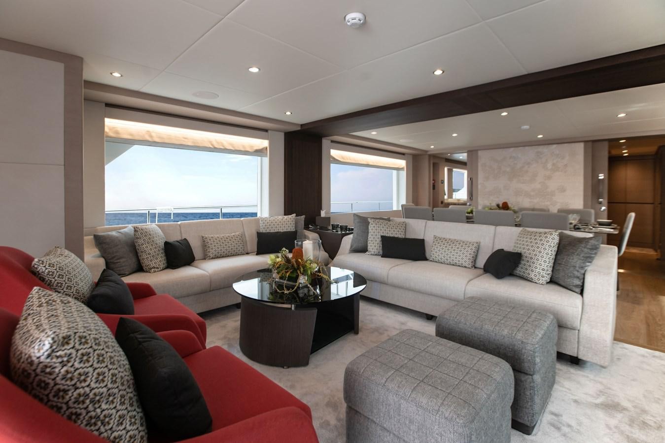 a living room with a large window aboard NOMAD 95 SUV Yacht for Sale