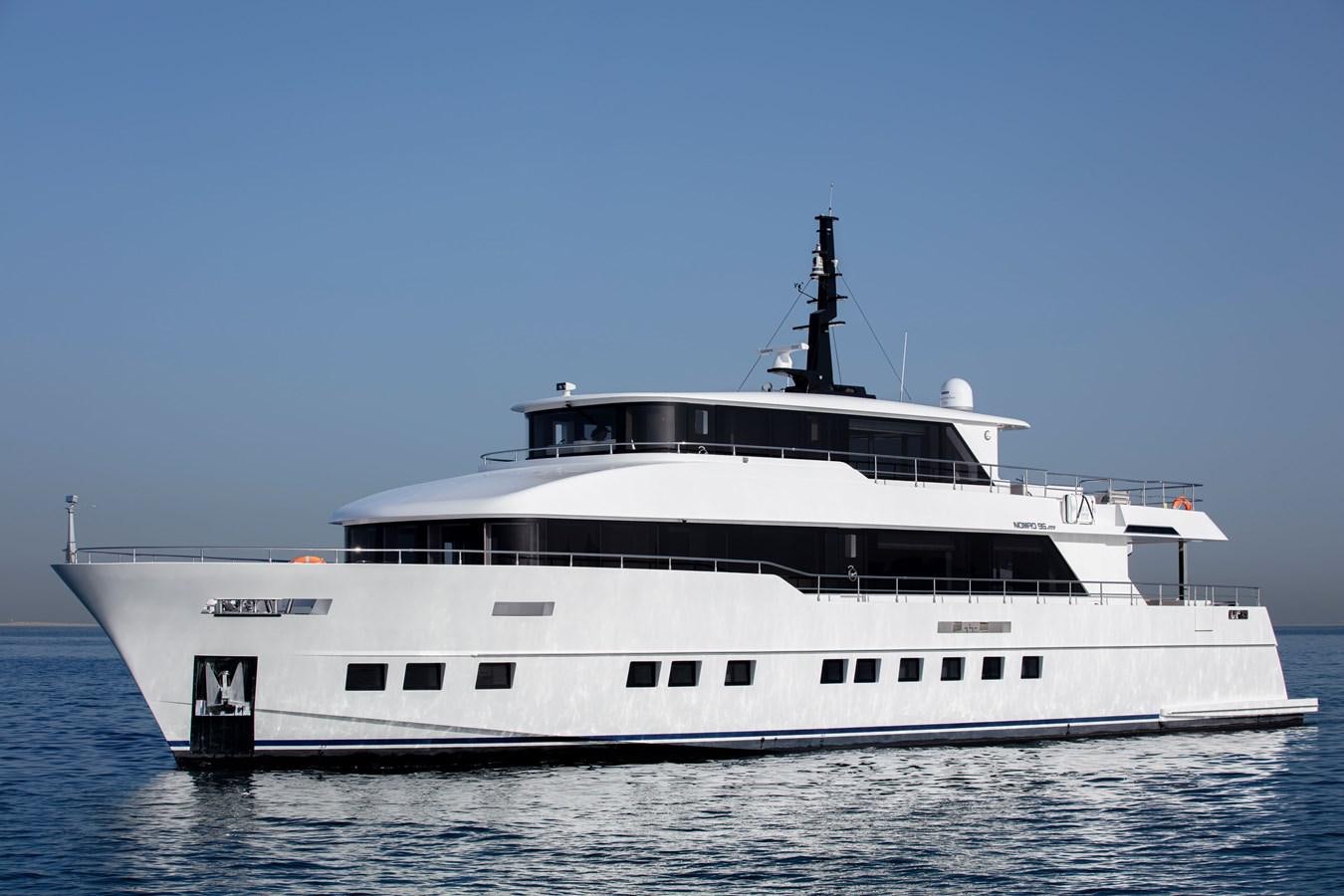 a large white yacht aboard NOMAD 95 SUV Yacht for Sale