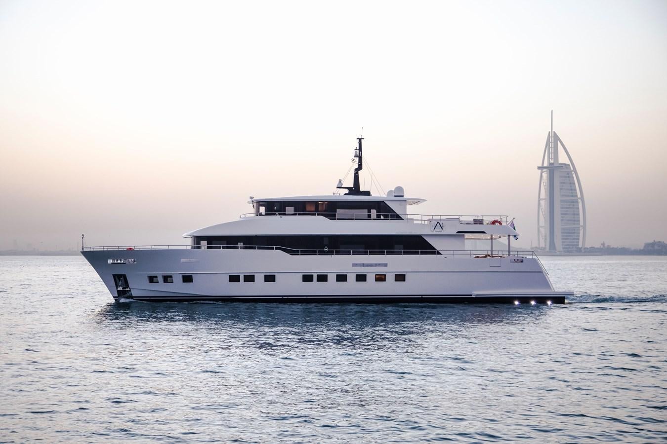 a large white boat in the water aboard NOMAD 95 SUV Yacht for Sale