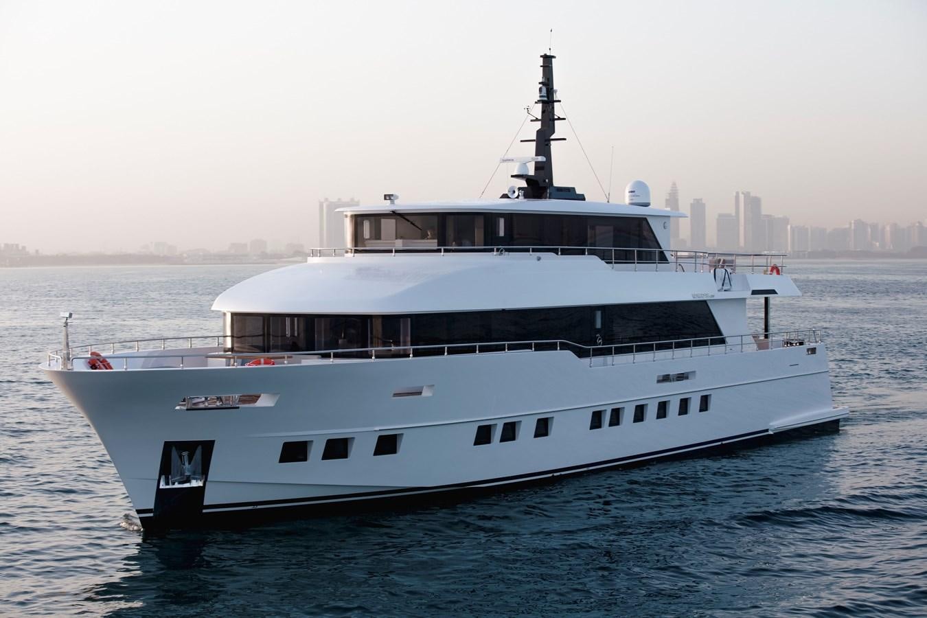 a large white boat in the water aboard NOMAD 95 SUV Yacht for Sale