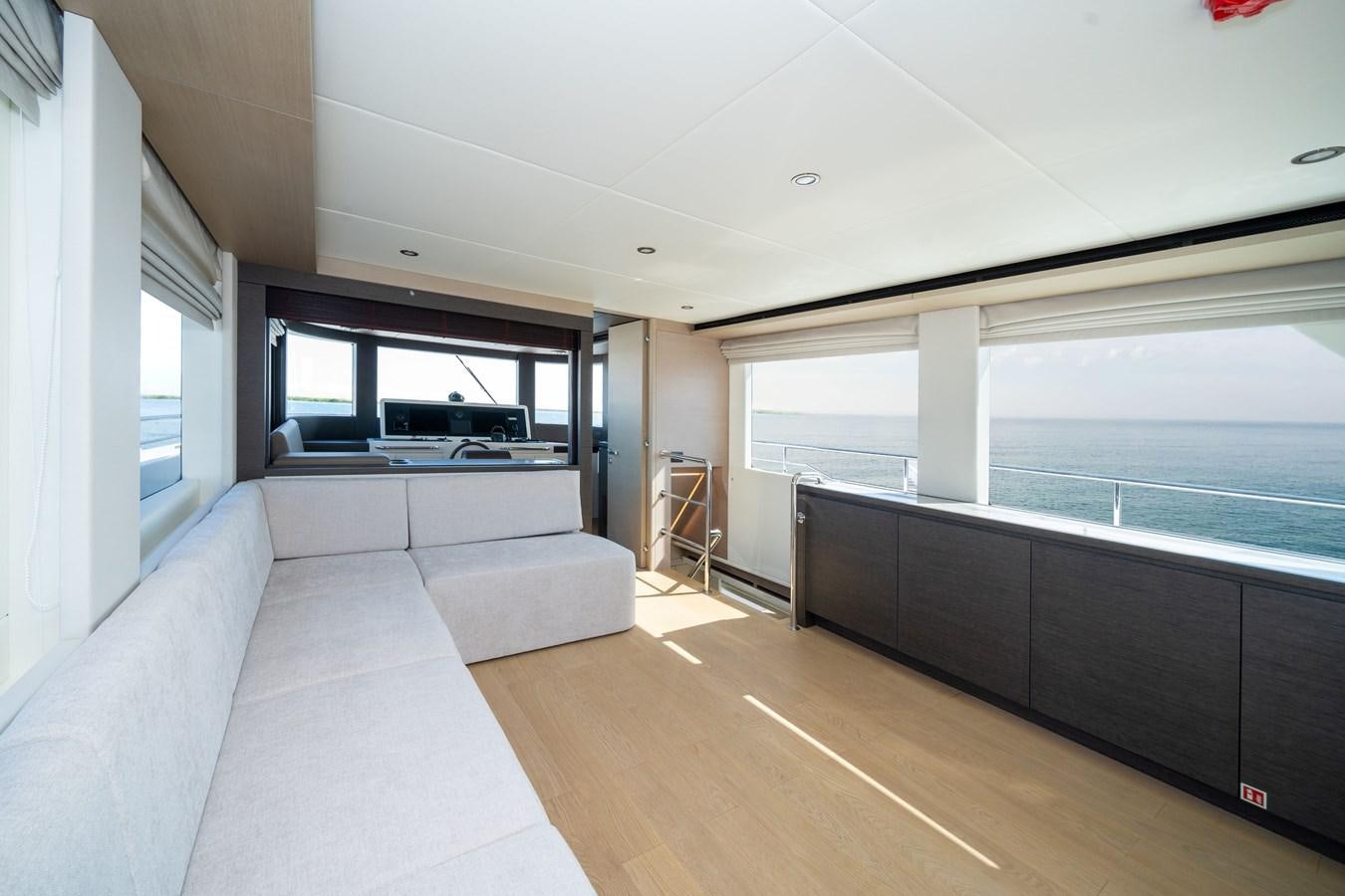 a living room with a couch and a tv aboard #4 NOMAD 75 SUV Yacht for Sale