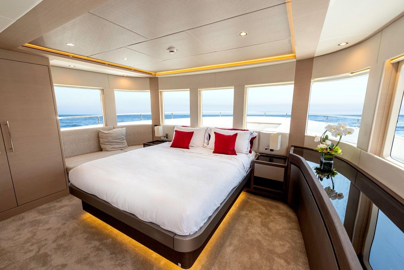 a bed in a room aboard #4 NOMAD 75 SUV Yacht for Sale