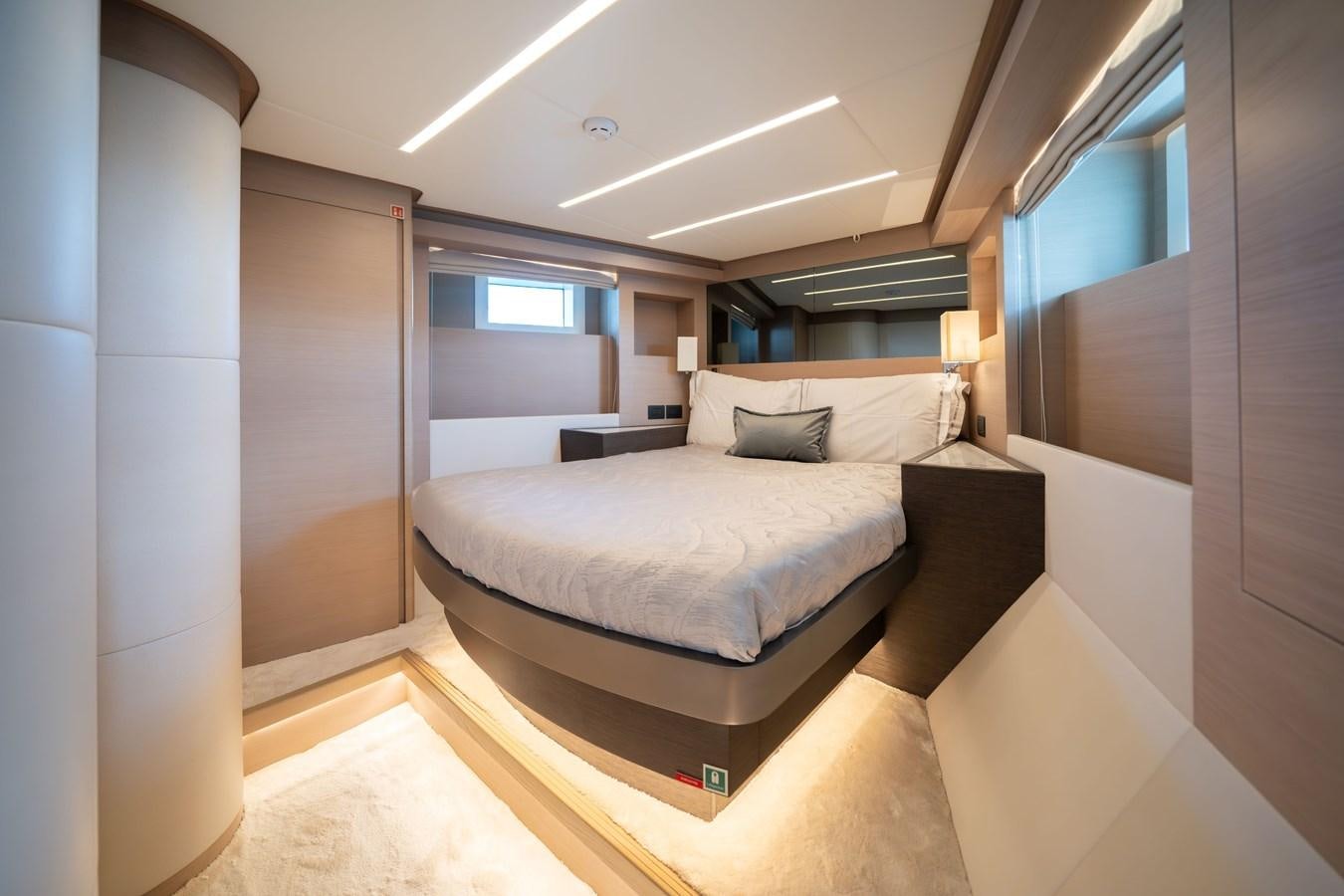 a large bedroom with a large bed aboard #4 NOMAD 75 SUV Yacht for Sale